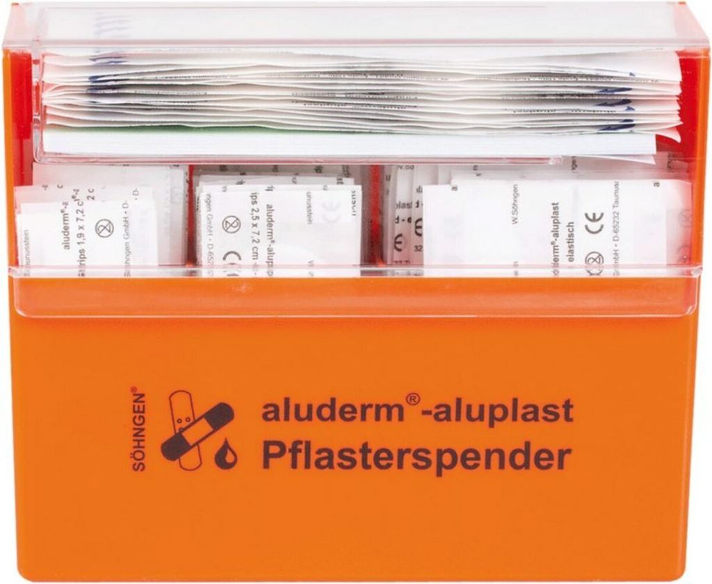 An orange first aid dispenser filled with various bandages.