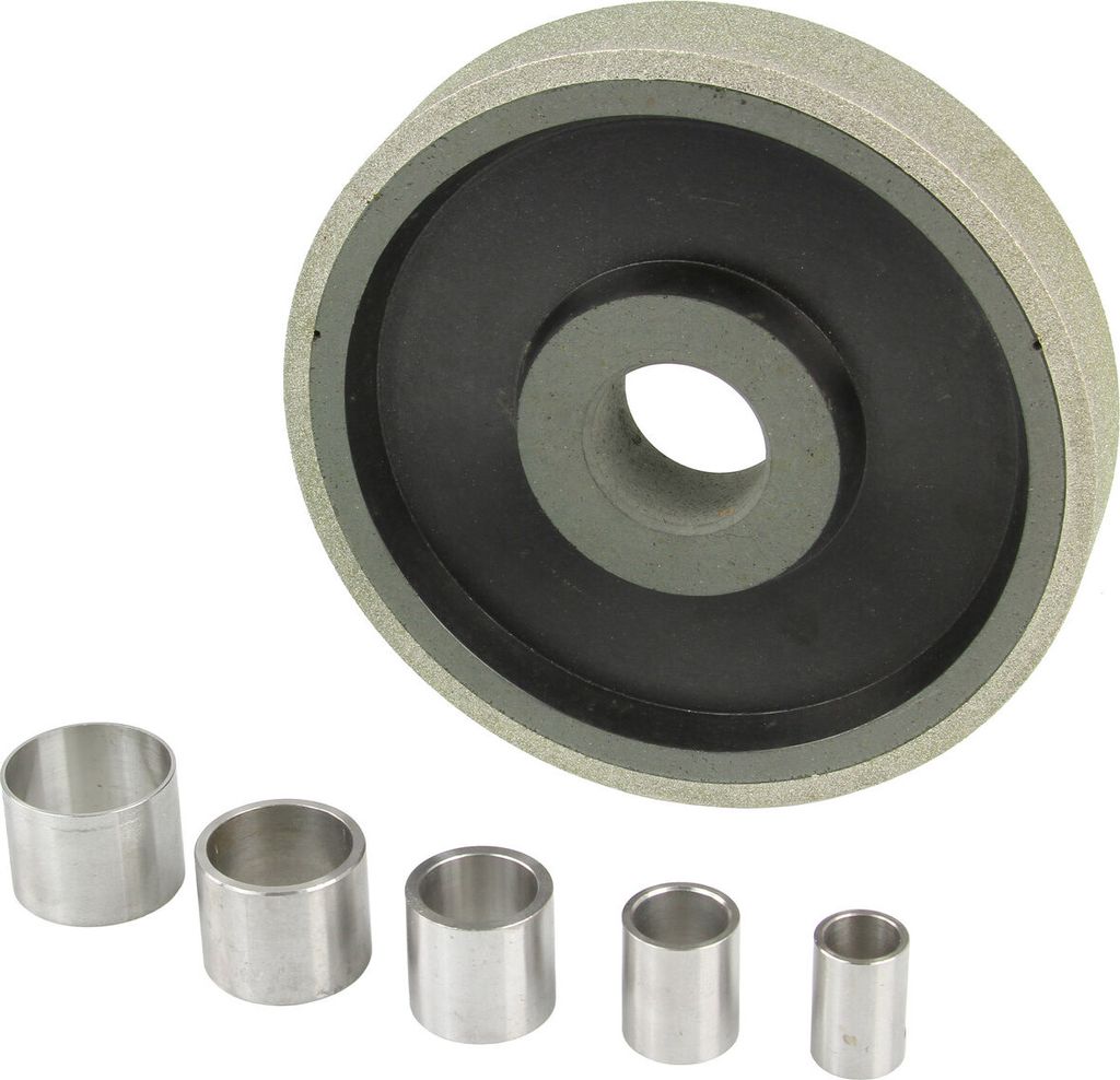 A diamond grinding wheel and several metal bushings are displayed against a white background.