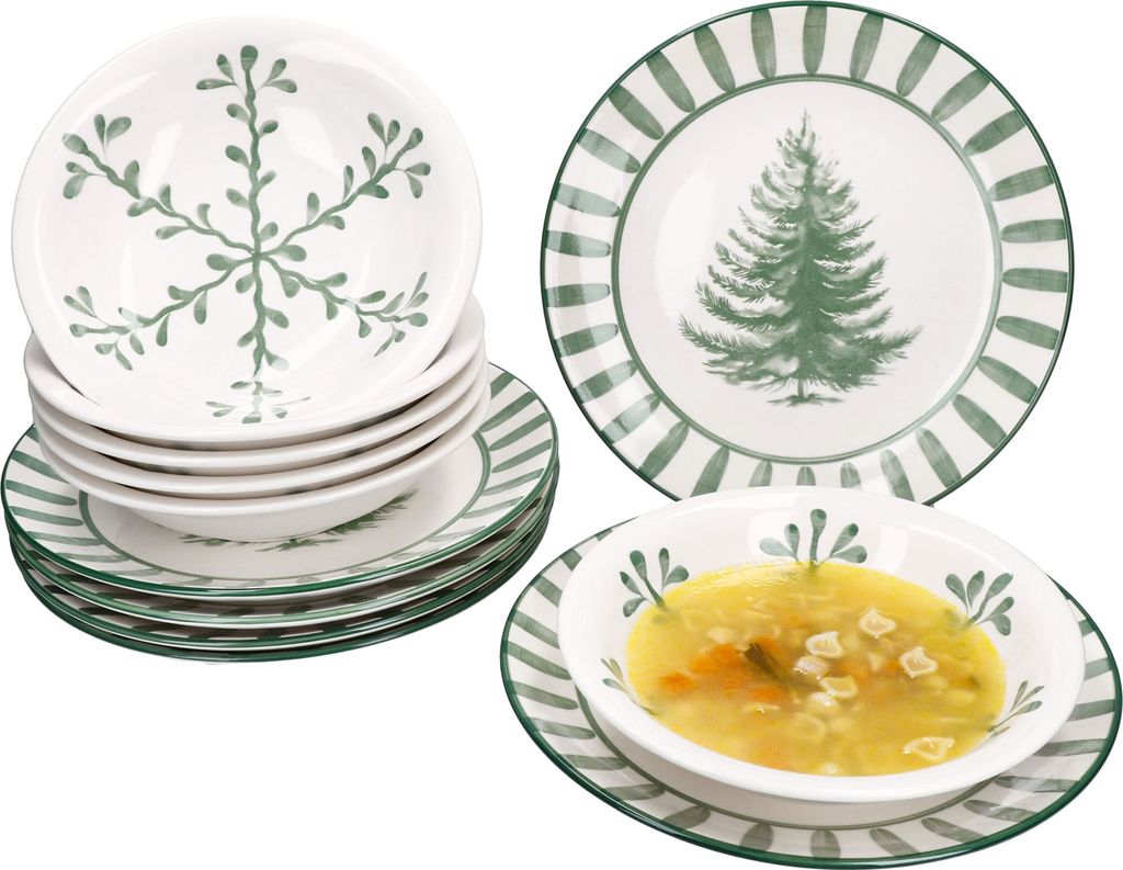 A set of Christmas-themed tableware with green pine tree and snowflake designs.