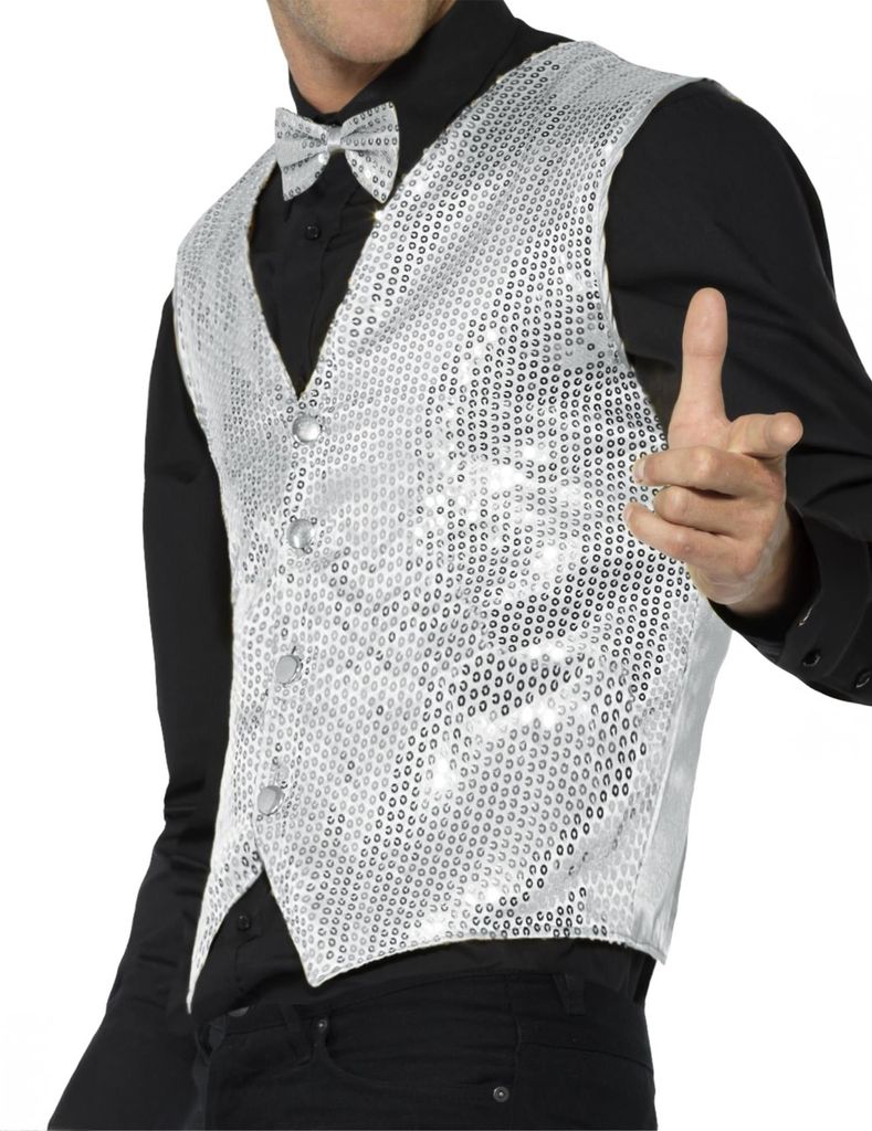 A man wearing a silver sequined vest and bow tie.