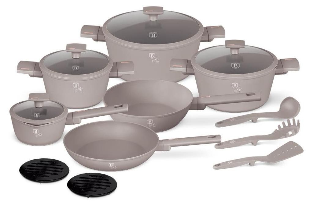 A set of cookware and utensils arranged on a white background.
