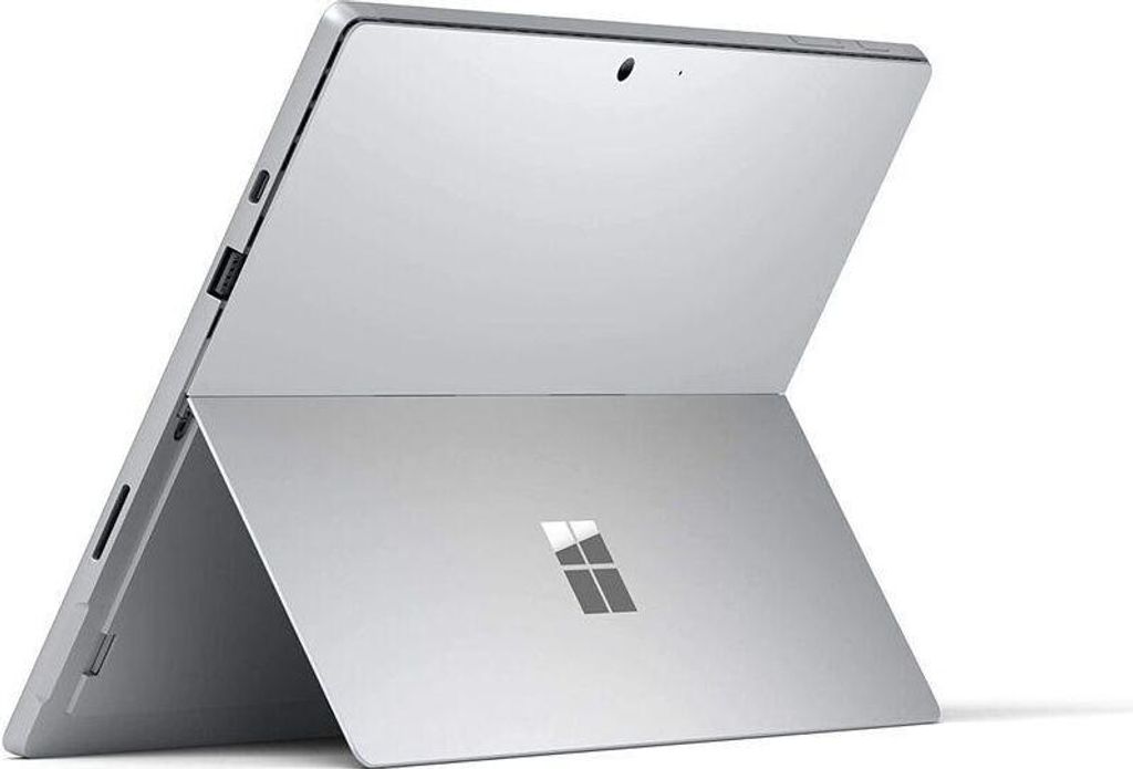 A silver Microsoft Surface laptop is shown from a rear-angled view, with its kickstand extended.