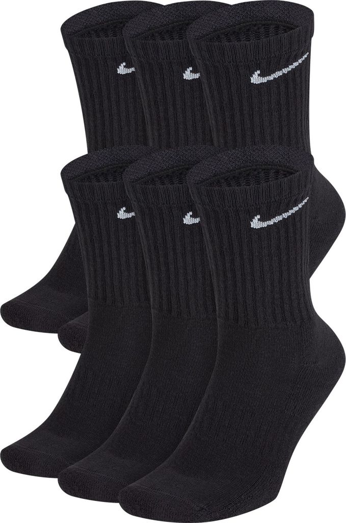 A stack of black Nike socks with white Nike logos.
