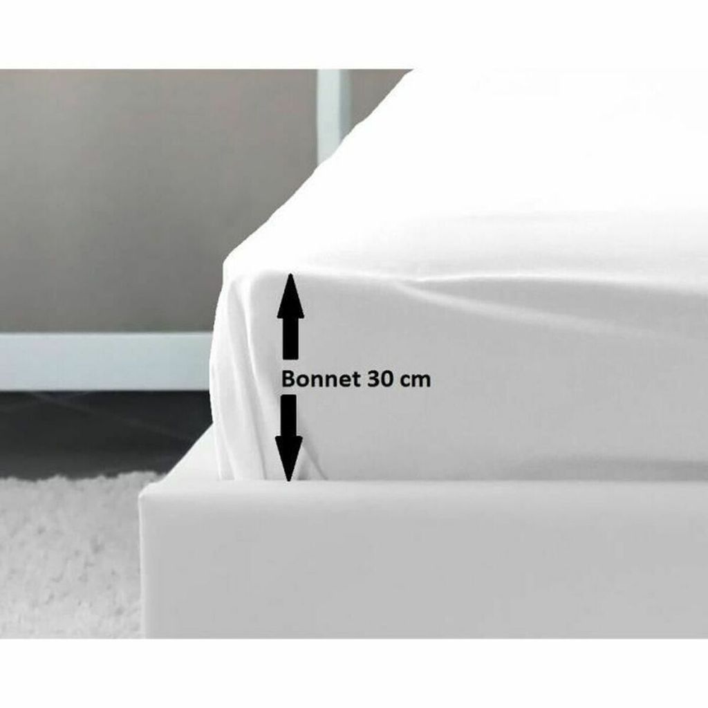 A close-up of a white fitted sheet on a bed, showing the depth of the sheet.