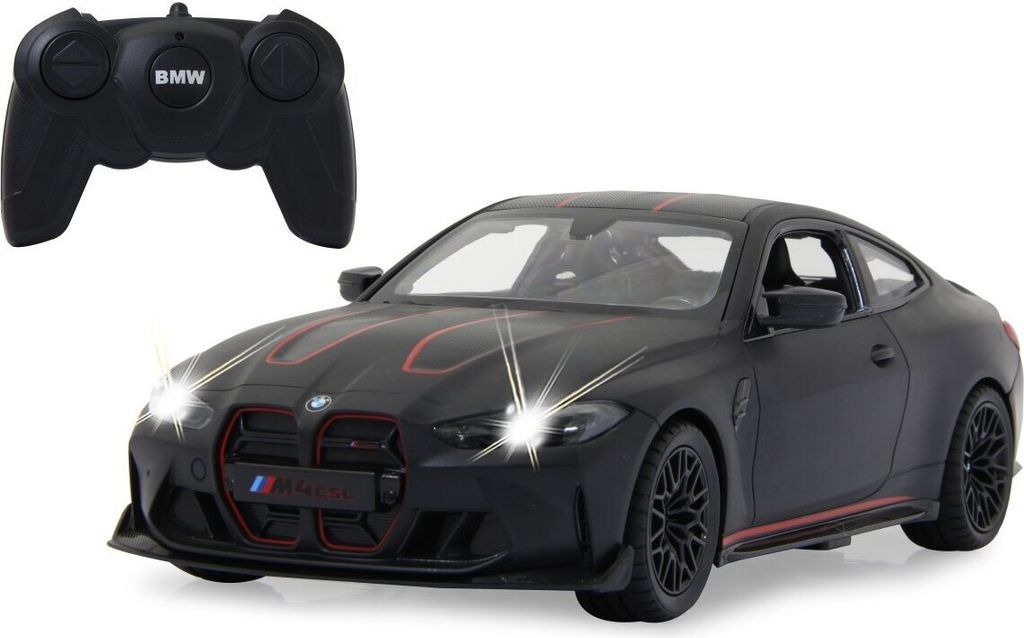 A black BMW M4 CSL toy car with red accents and a remote control.