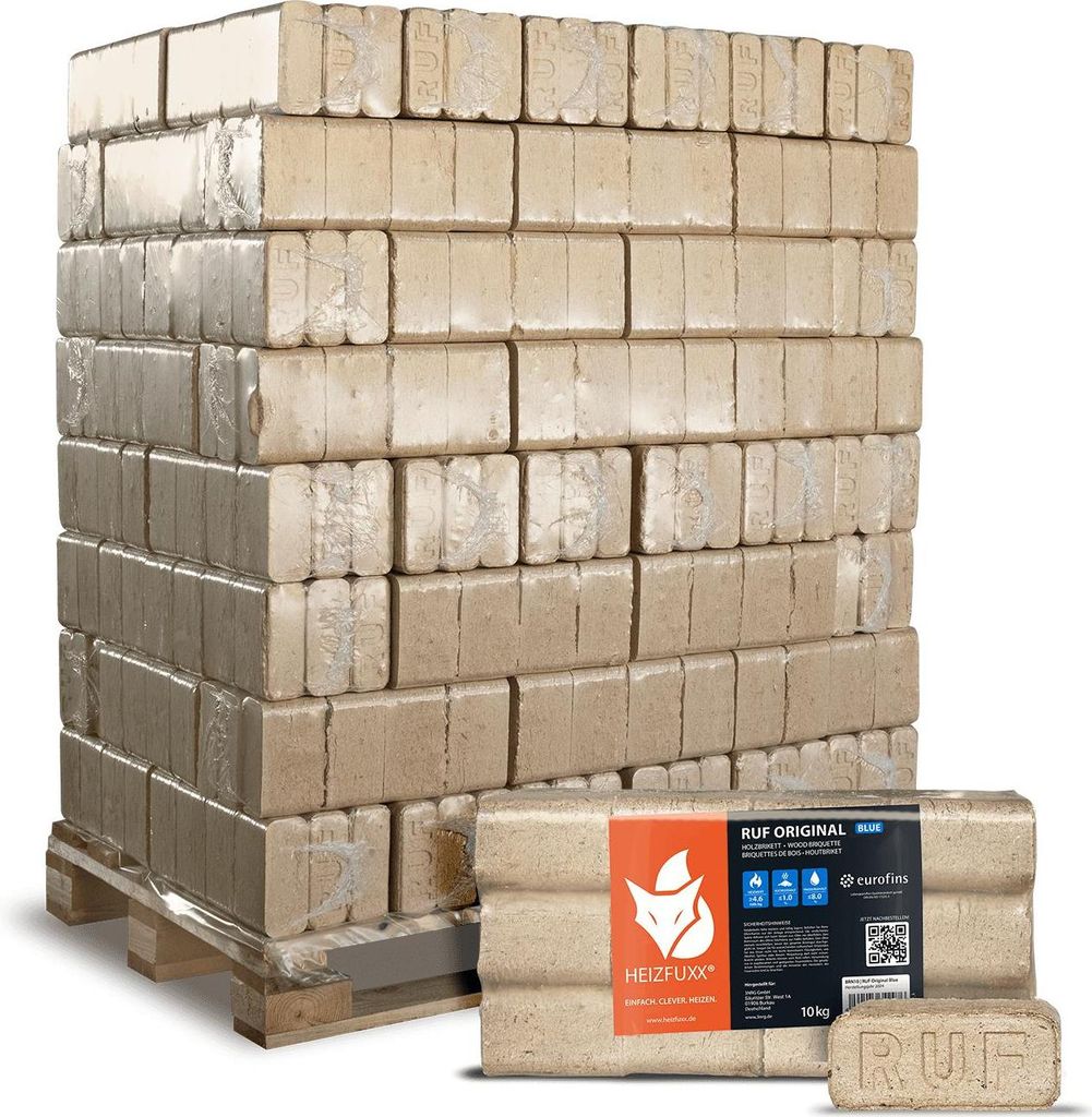 A pallet of compressed wood briquettes for heating, with a smaller package of briquettes in the foreground.