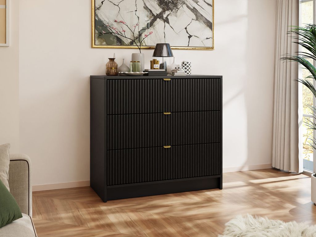 A modern black dresser in a well-lit room.