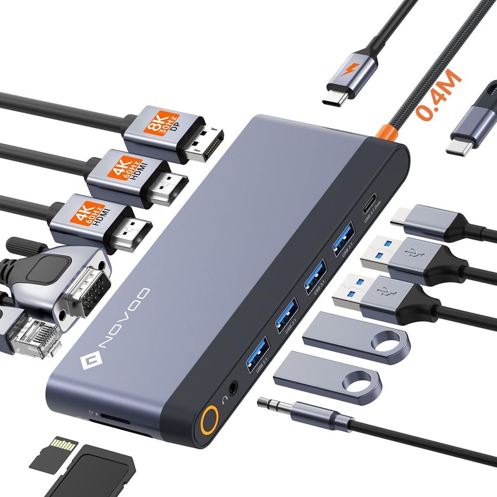 A docking station with various cables and adapters arranged around it.