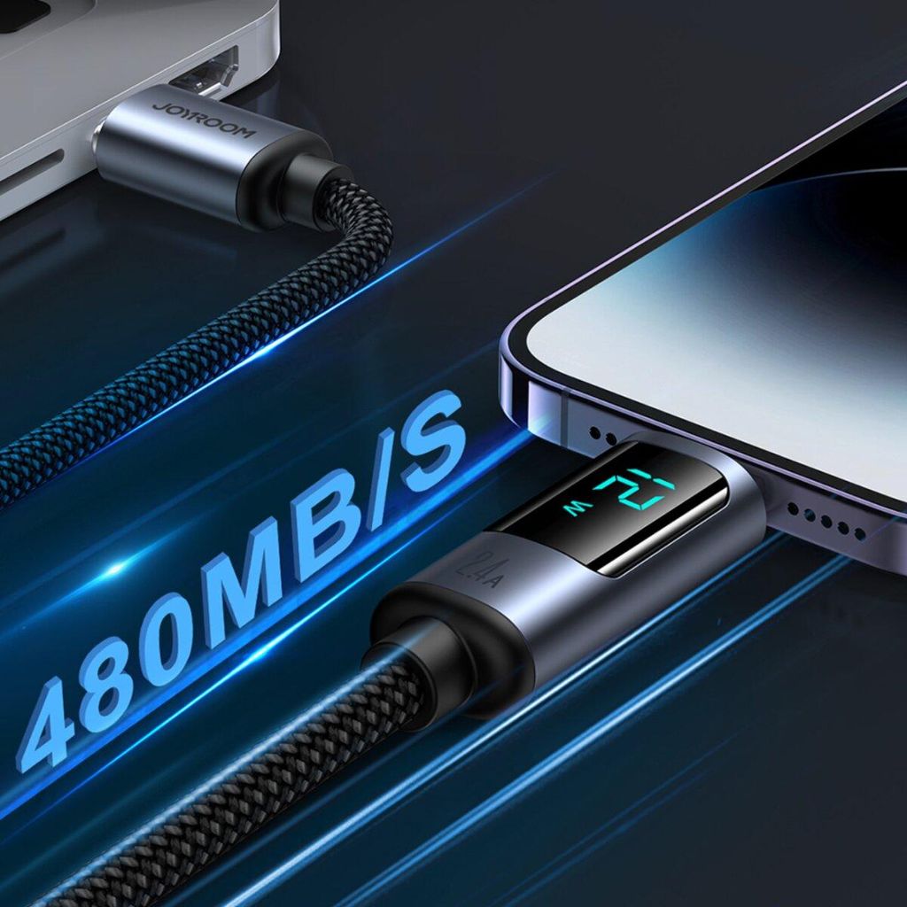 A charging cable connecting a laptop to a smartphone, with a digital display showing charging wattage.