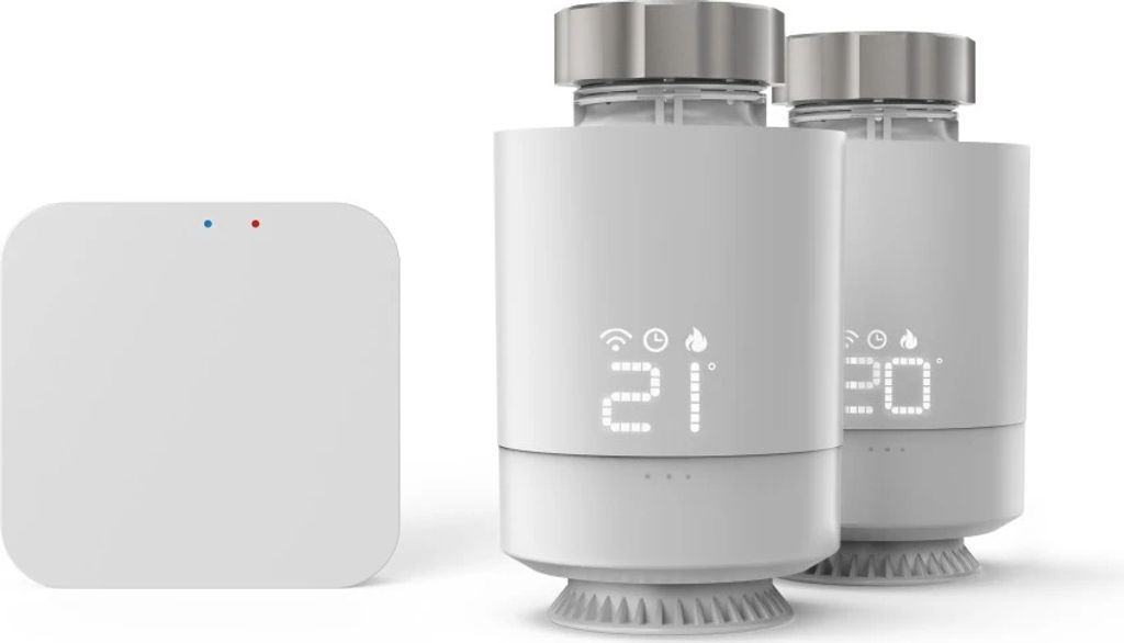 A white smart home hub and two smart radiator thermostats are shown against a white background.