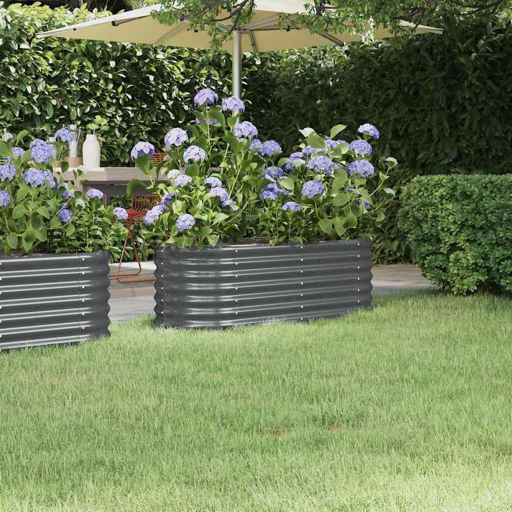 A garden scene with raised garden beds and hydrangeas.