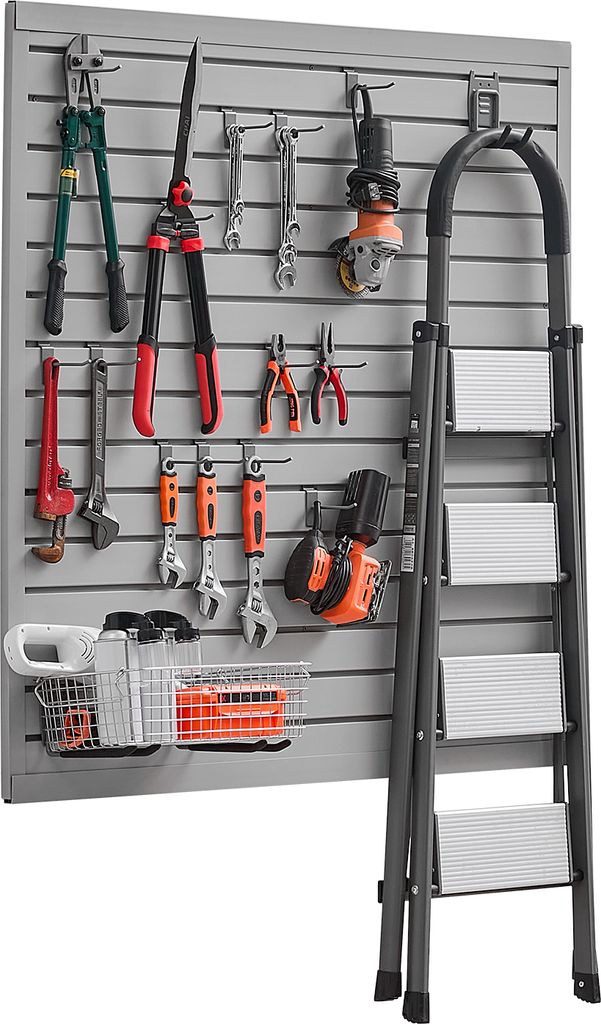 A wall-mounted tool organizer with various tools and a ladder.