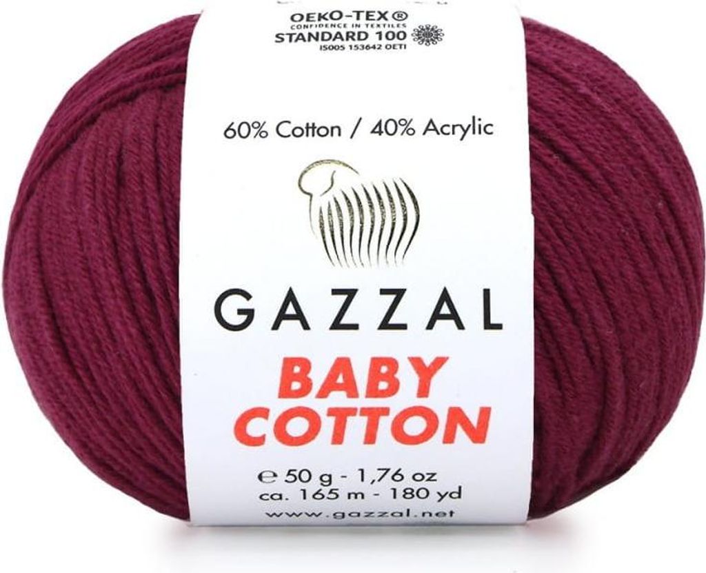 A ball of burgundy yarn with a label showing product details.