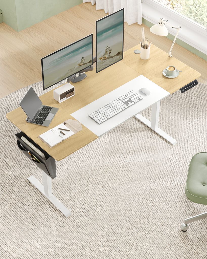 A modern home office setup with a standing desk, monitors, laptop, and chair.