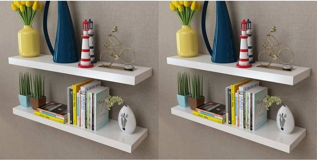 Two identical sets of white floating shelves are displayed on a light gray wall, each adorned with various decorative items and books.
