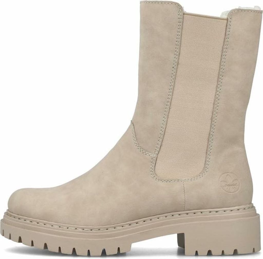 A side view of a beige Chelsea boot with a thick sole.
