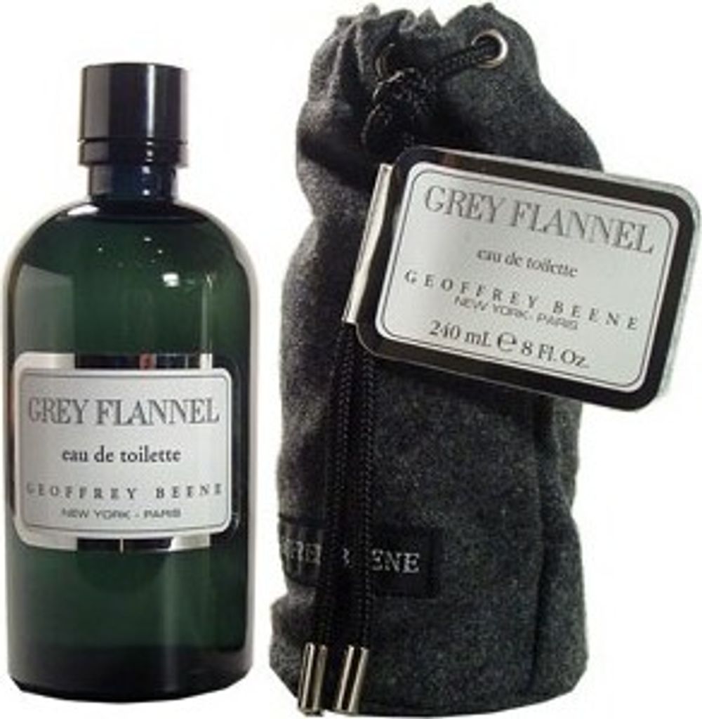 A bottle of Geoffrey Beene Grey Flannel Eau de Toilette and its accompanying drawstring pouch are displayed against a light gray background.