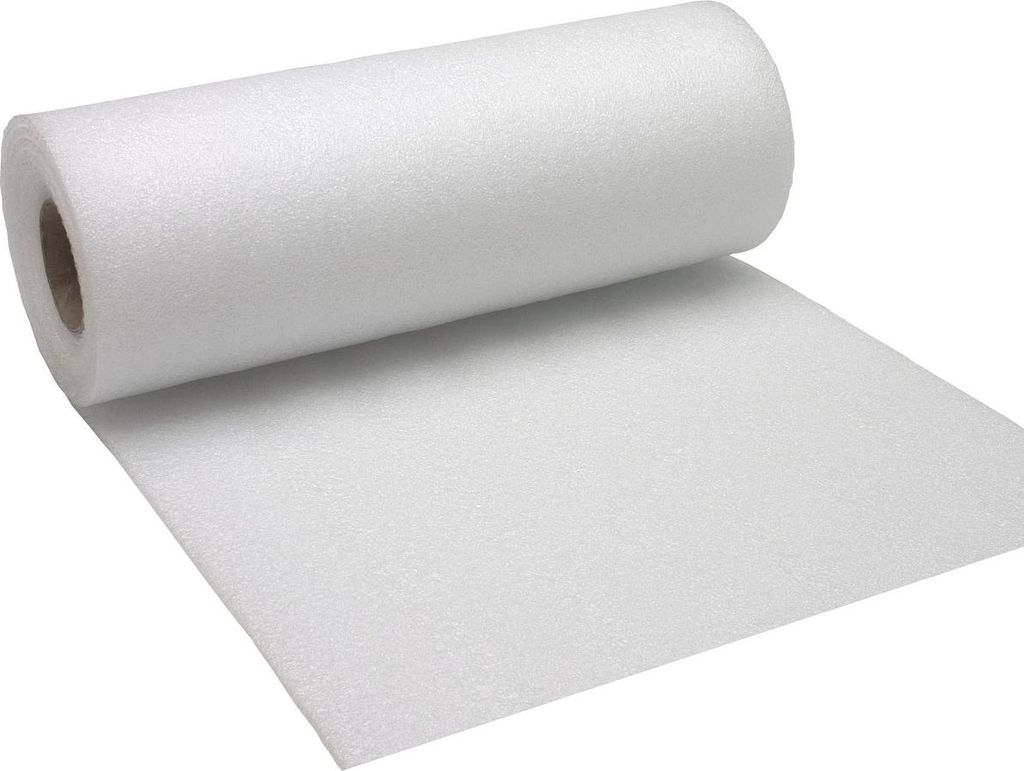 A roll of white foam material is shown, with a portion unrolled onto a flat surface.