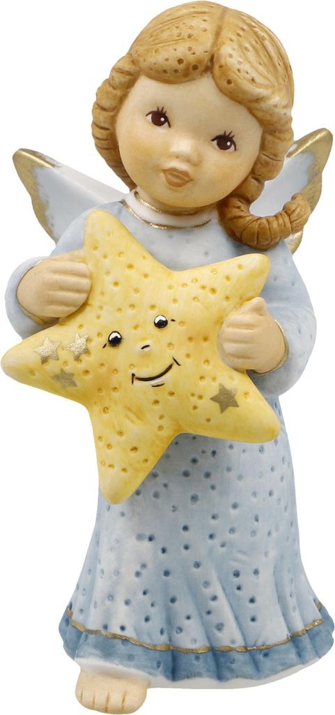 A ceramic figurine of an angel holding a star.