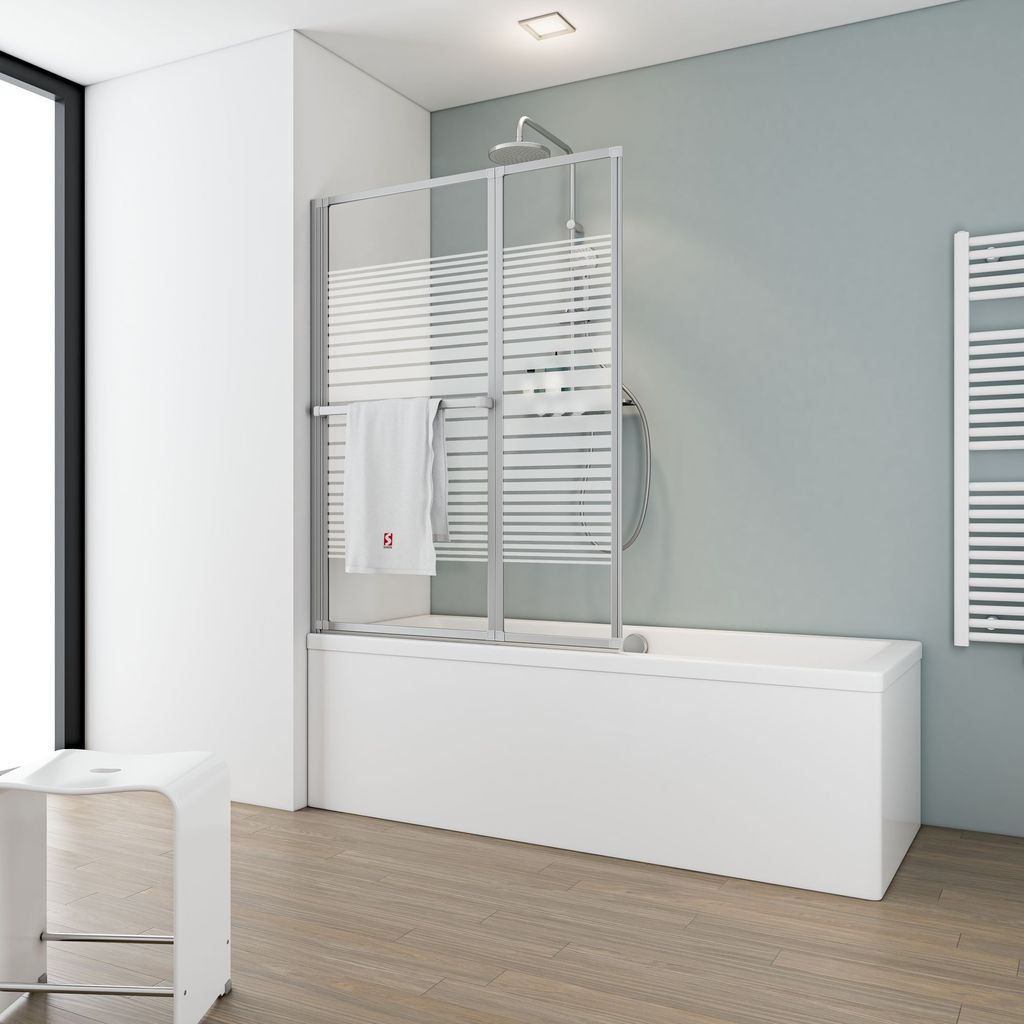 A modern bathroom with a bathtub and shower screen.
