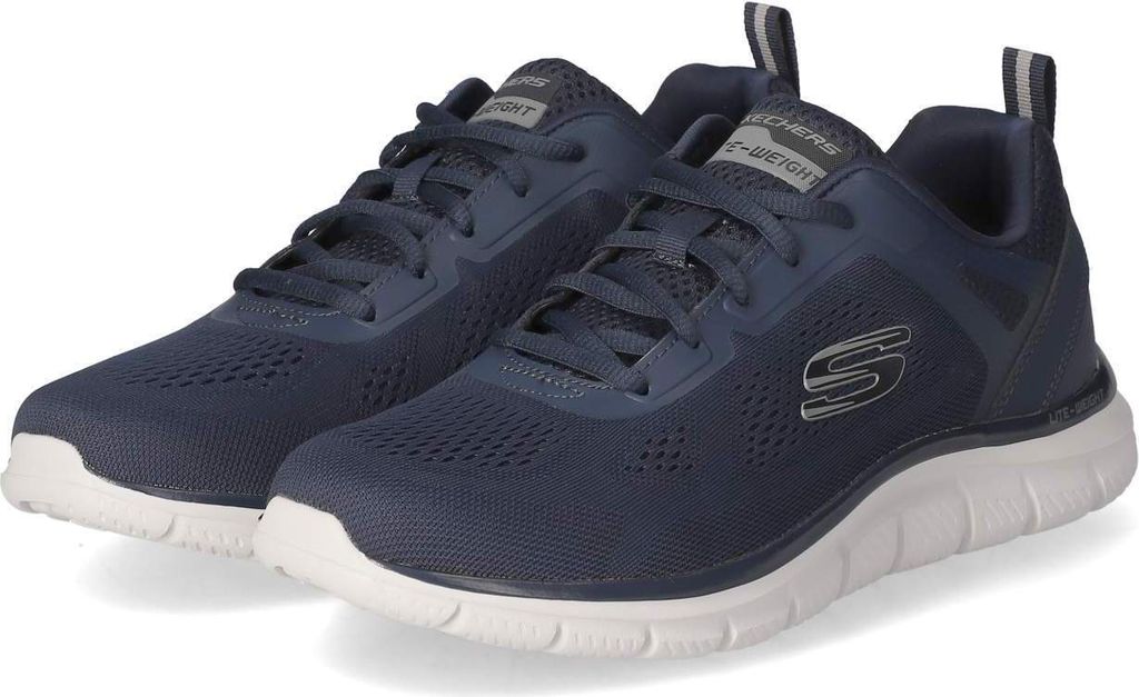 A pair of navy blue Skechers sneakers with white soles are shown against a white background.