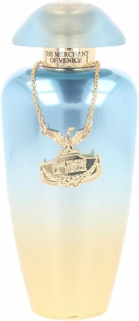 A perfume bottle with a gold chain and pendant.