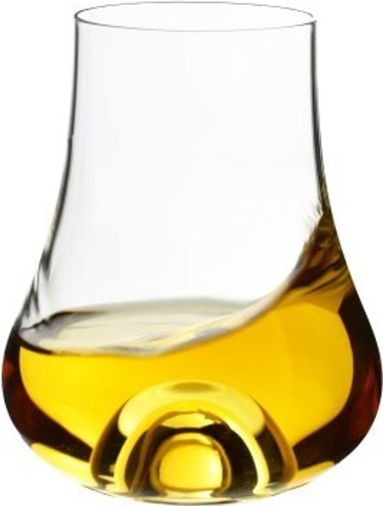 A close-up shot of a whiskey or rum glass filled with amber liquid.