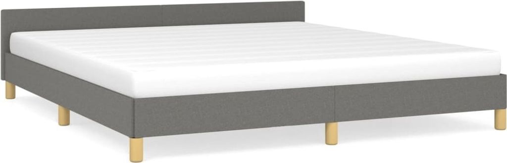 A modern grey fabric bed frame with a white mattress on a white background.