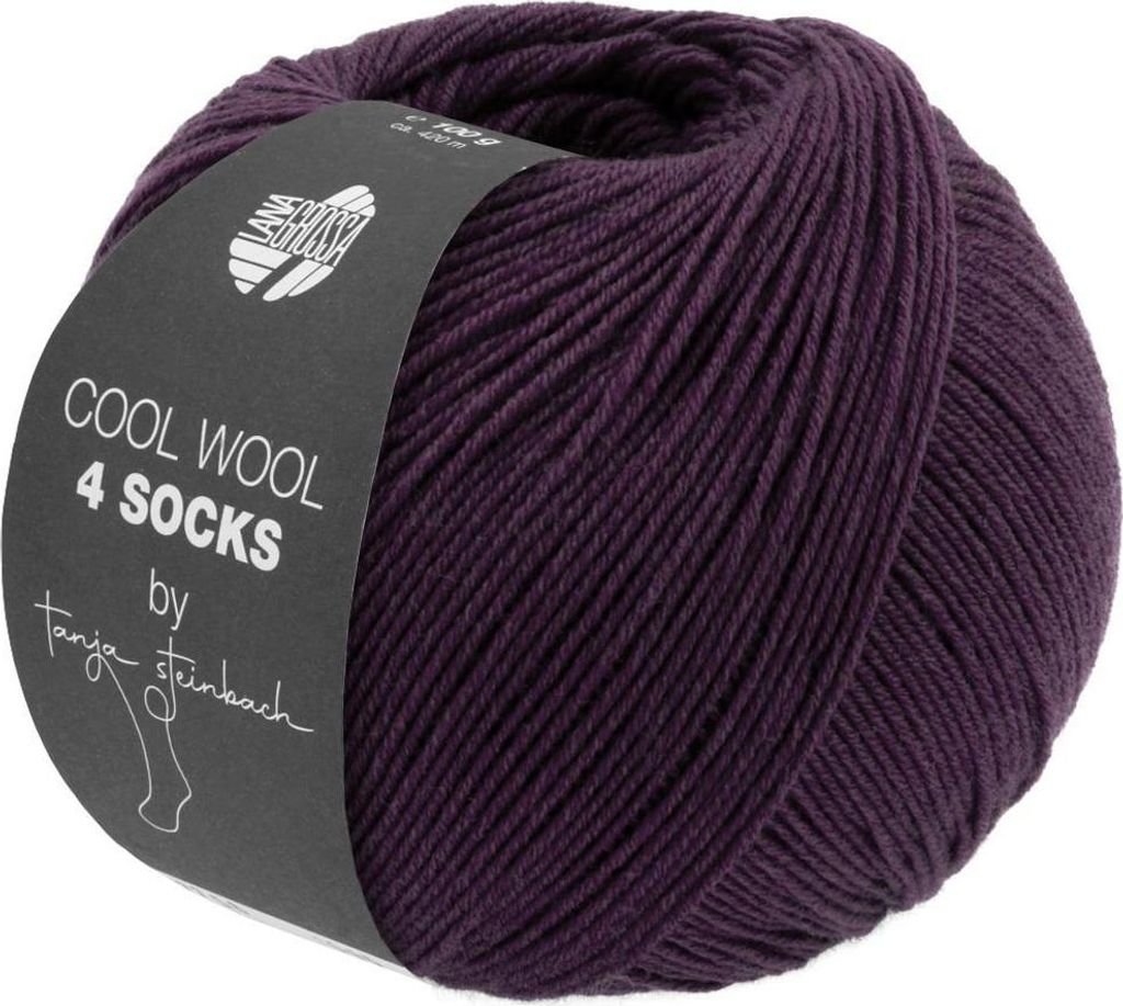 A ball of purple yarn with a black label wrapped around it.