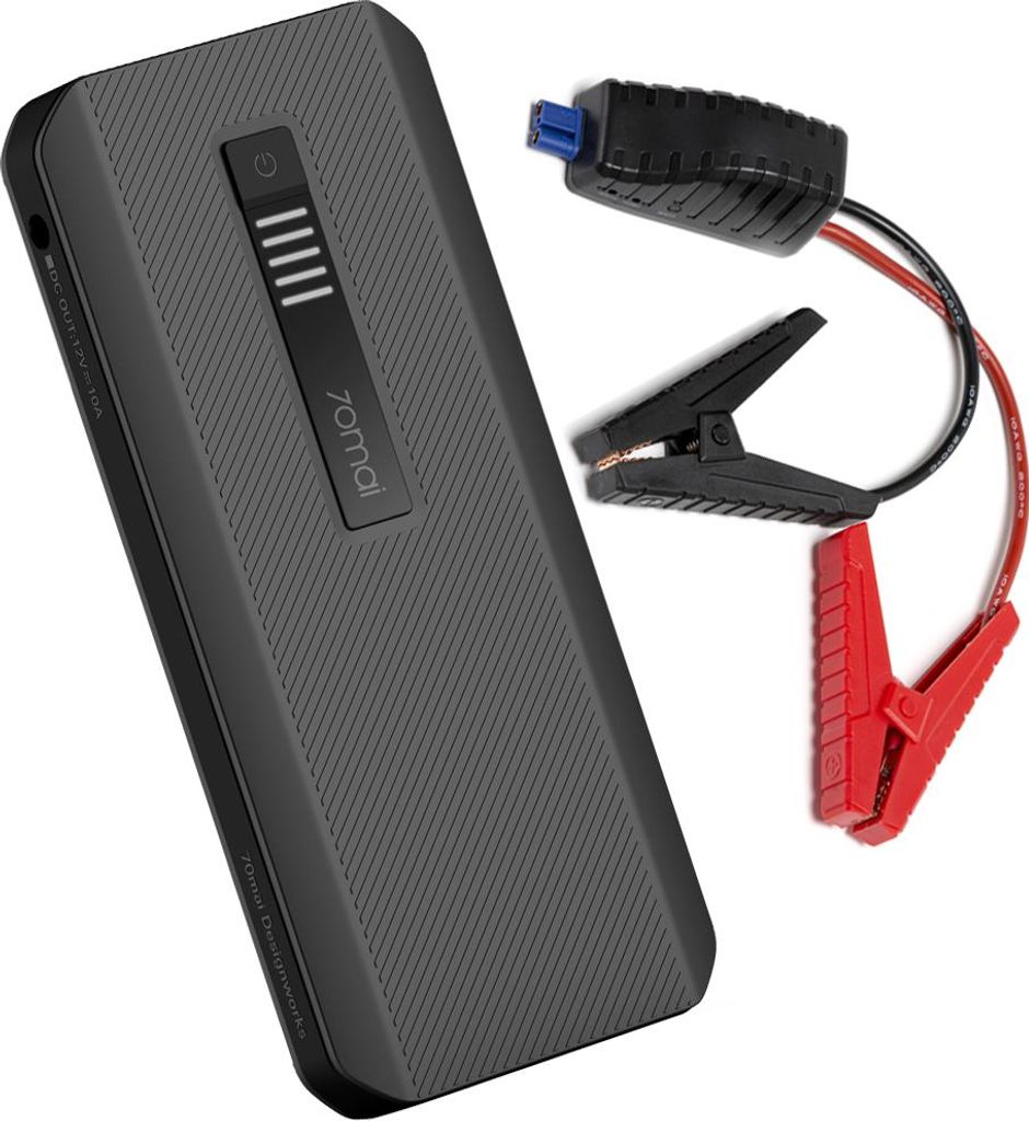 A black jump starter with red and black jumper cables attached.
