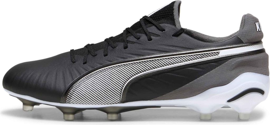 A side view of a black and gray Puma soccer cleat against a white background.