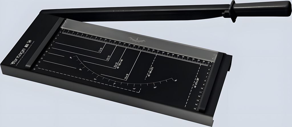 A black paper cutter with measurement markings on its surface, shown from a slightly elevated angle.