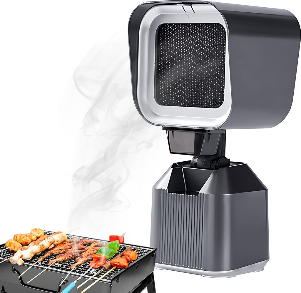 A close-up view of a portable grill with food, with a smoke extractor device in the background.