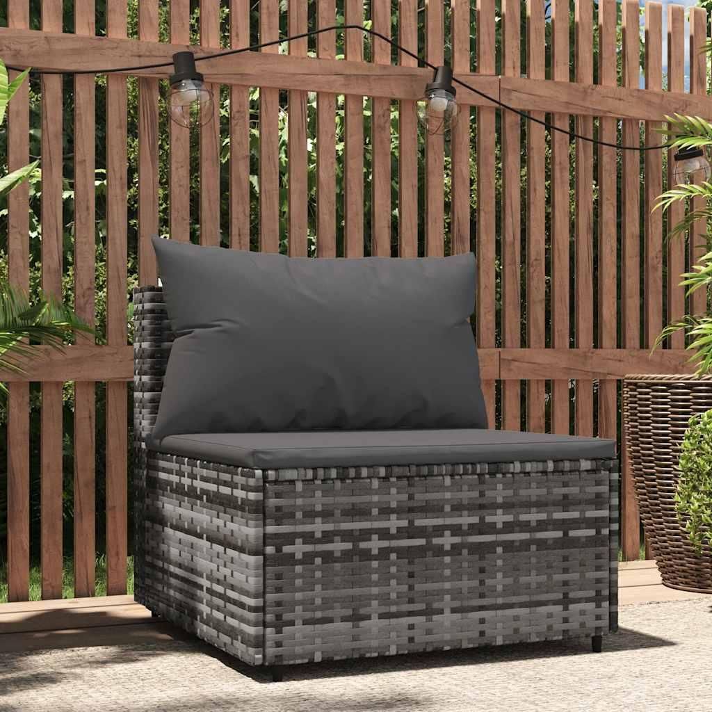 An outdoor patio scene with a rattan sofa and cushions, set against a wooden fence with string lights.
