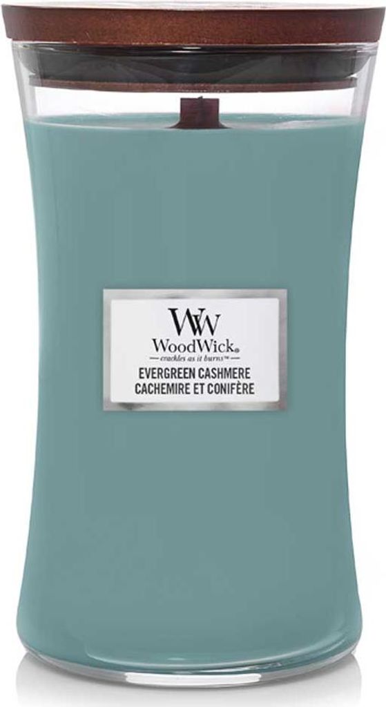 A WoodWick Evergreen Cashmere candle in a glass jar with a wooden lid.