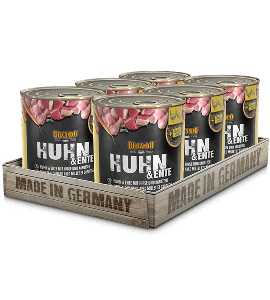 A six-pack of dog food cans in a wooden tray.
