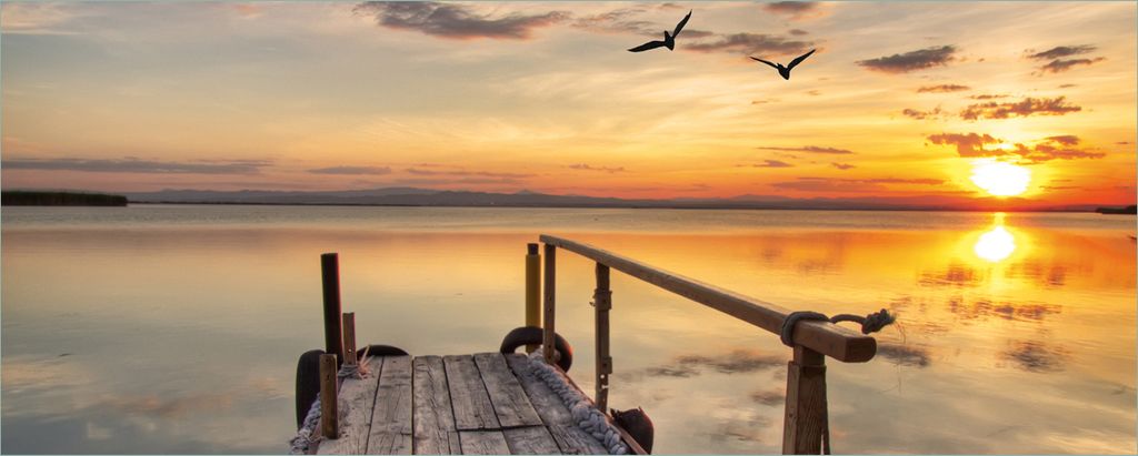 Wallario Poster - Sonnenuntergang über dem See idyllischer Steg, Kunstdruck Größe: 50 x 125 cm