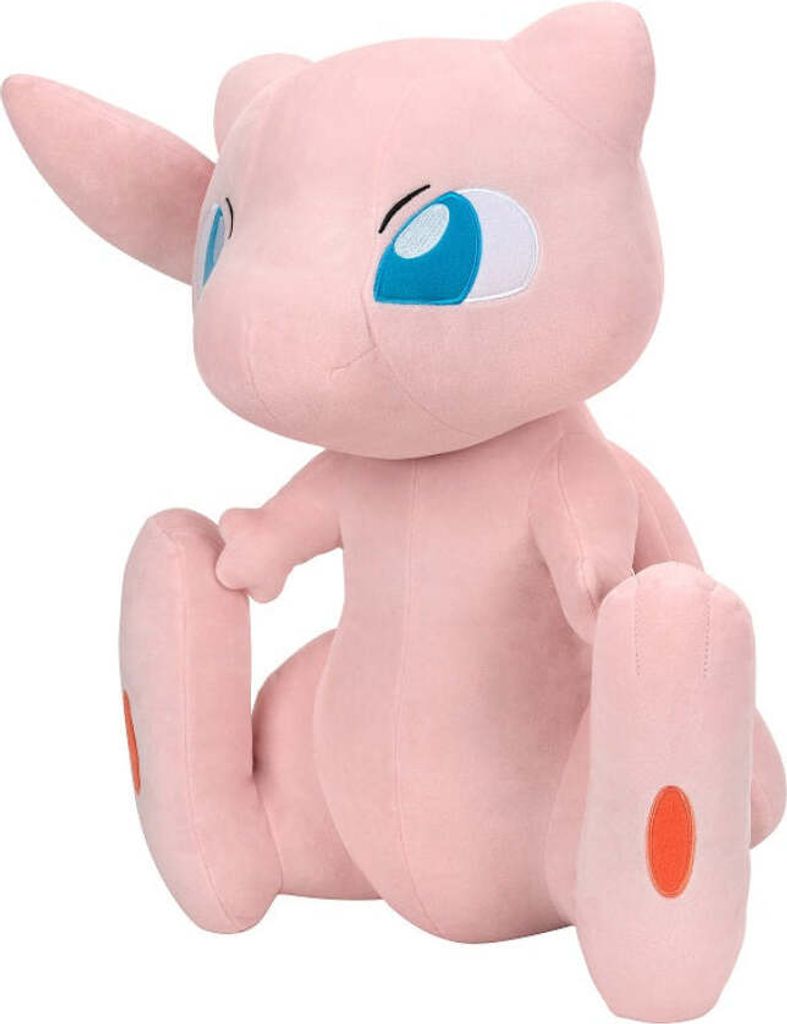 A plush toy of the Pokémon character Mew is sitting on a white background.