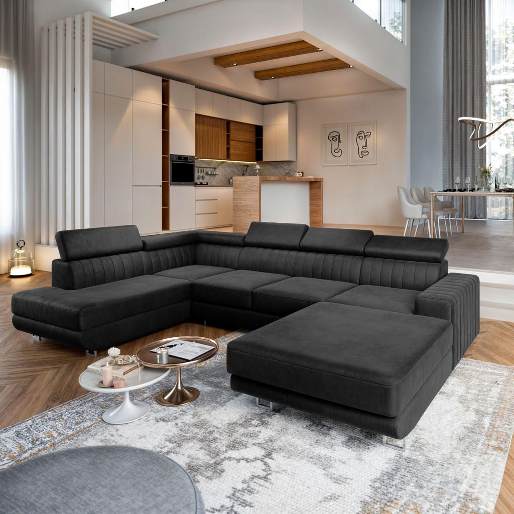 A modern living room with a large sectional sofa, kitchen area, and dining area visible in the background.