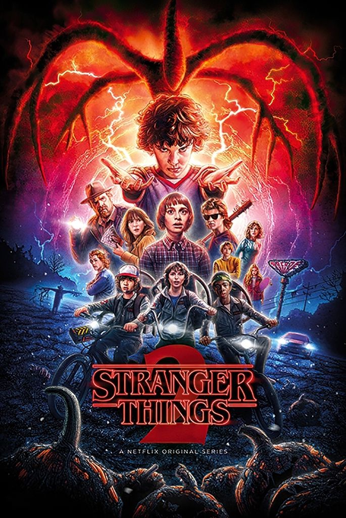 A movie poster for Stranger Things 2, featuring the main characters and a monster.