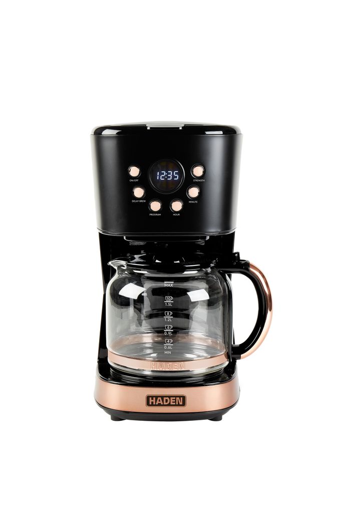 A black and copper coffee maker with a glass carafe on a white background.