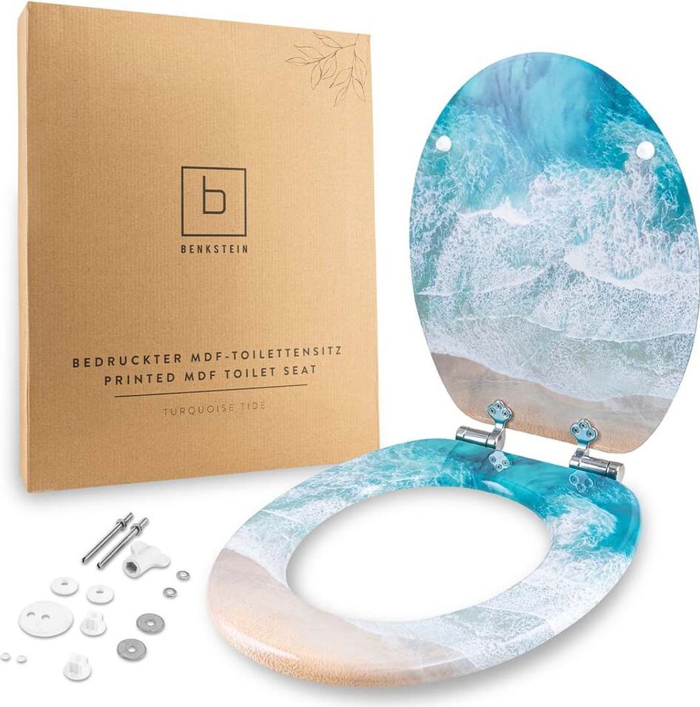 A toilet seat with a beach and ocean wave design, displayed next to its packaging and mounting hardware.