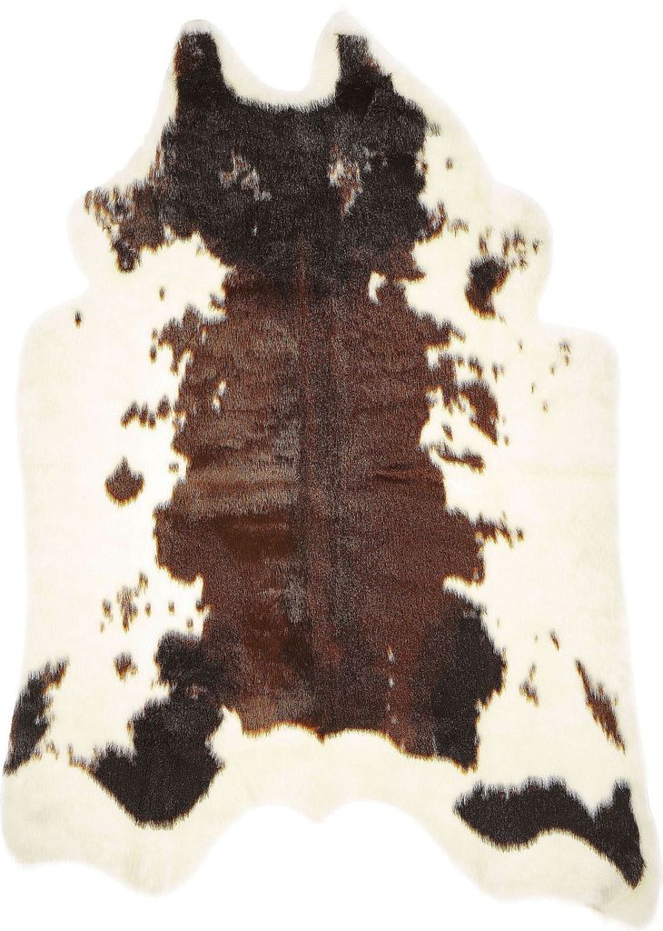 A cow-print rug on a white background.