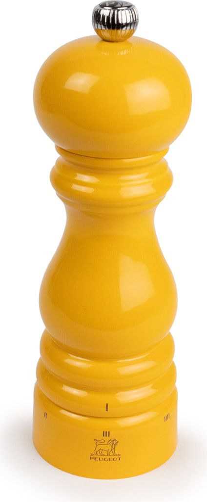 A yellow pepper mill on a white background.