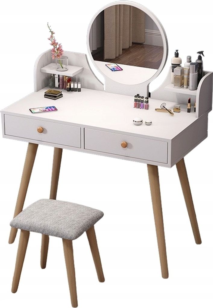 A white vanity table with a round mirror and a stool, set against a white background.