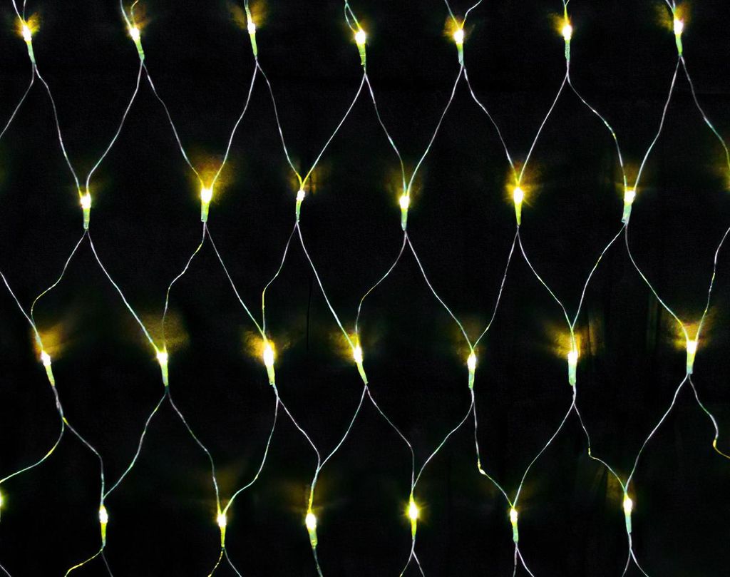 A close-up view of a net of warm white LED lights against a black background.