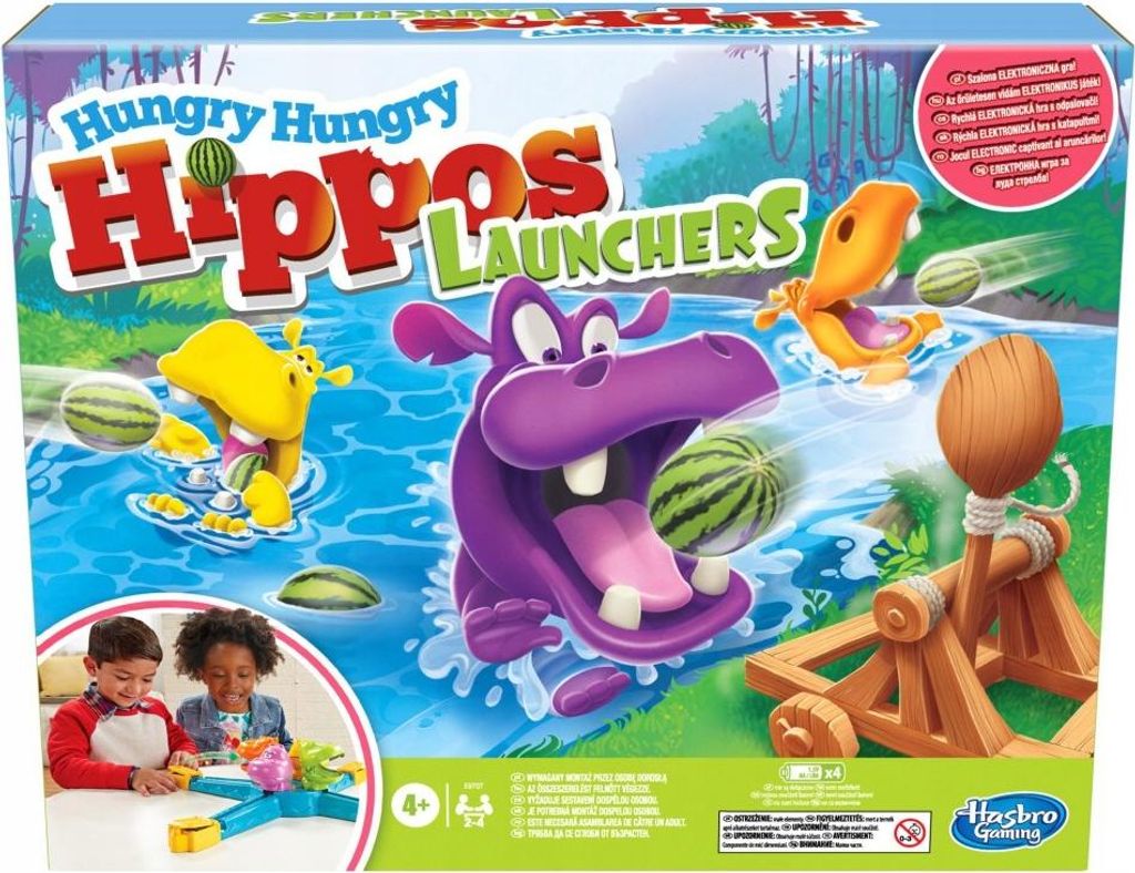 The image shows the box of the Hungry Hippos Launchers board game, featuring cartoon hippos and watermelons.