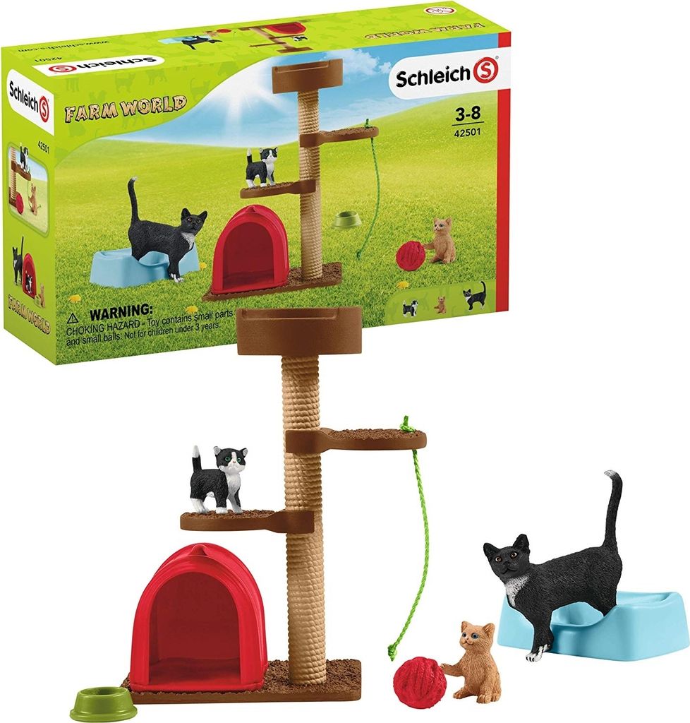 A product box and the contents of a Schleich Farm World cat playset.