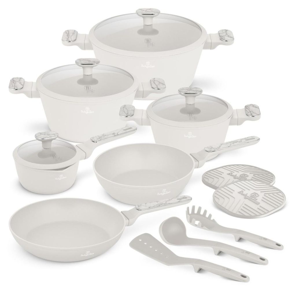 A collection of white cookware and utensils arranged on a white background.