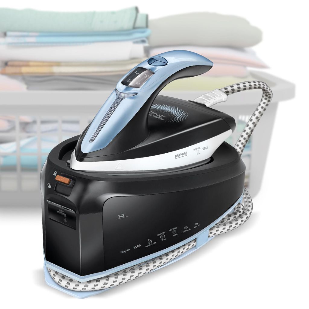 A steam ironing station with a laundry basket and folded clothes in the background.